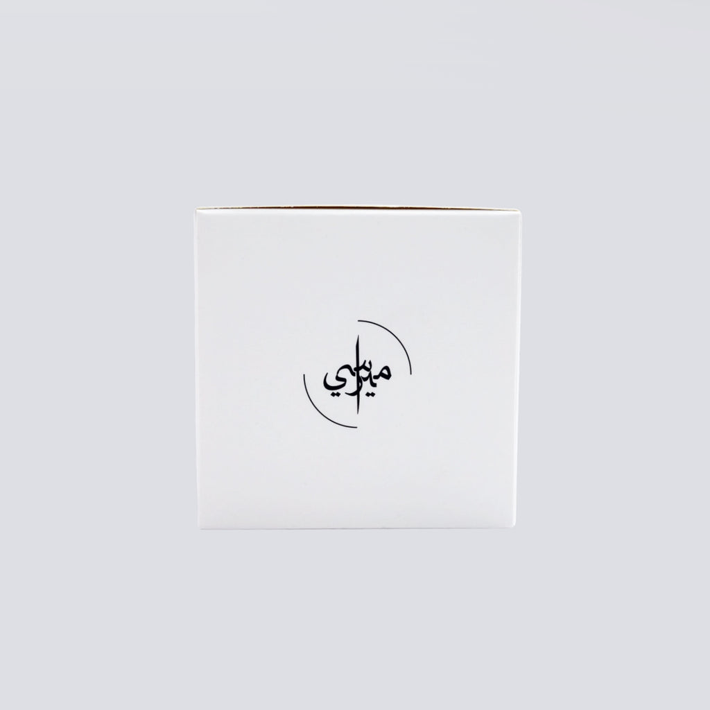 White box with black Arabic calligraphy on a light gray background